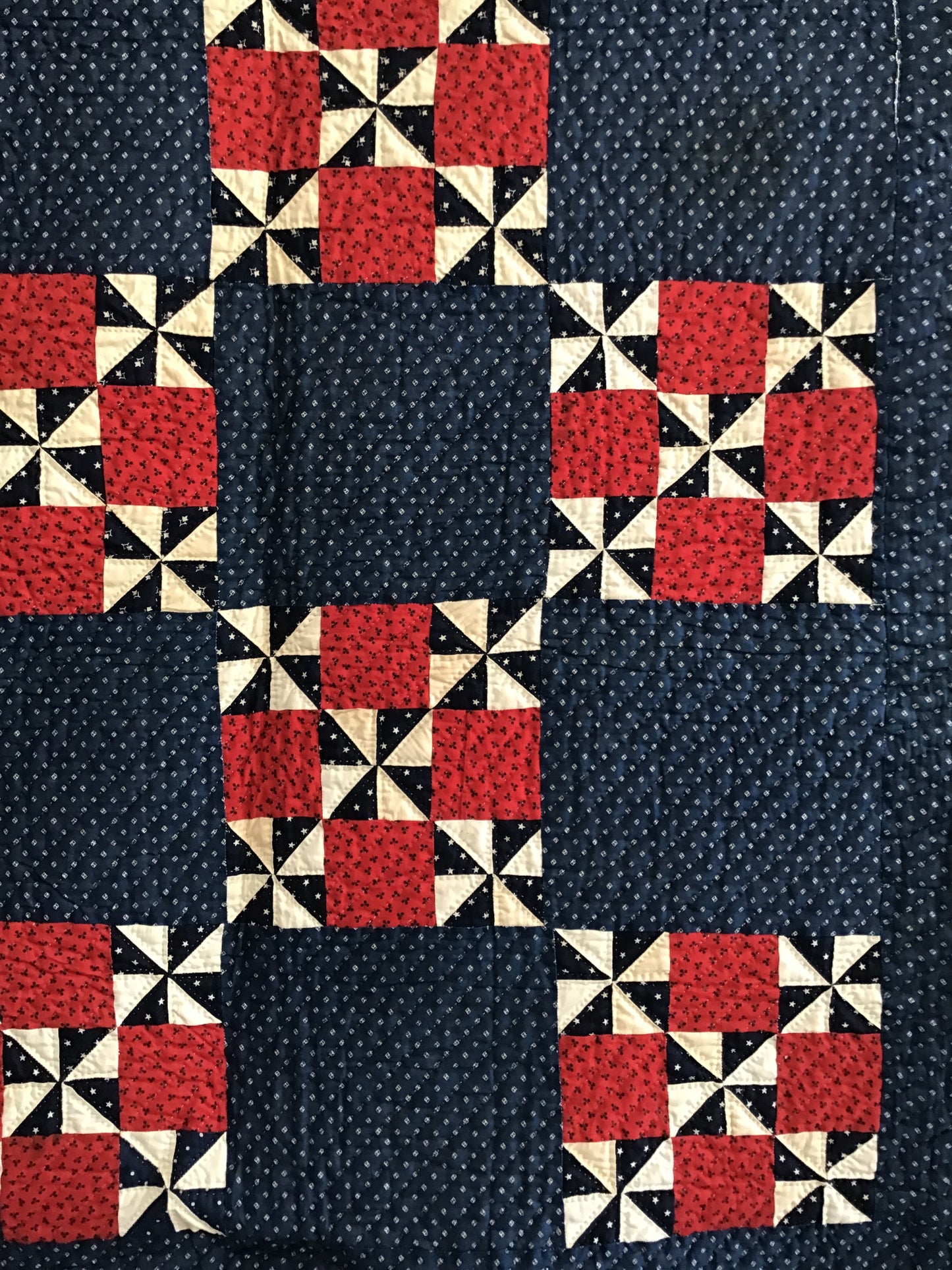 Blue pinwheel with red 9 patch