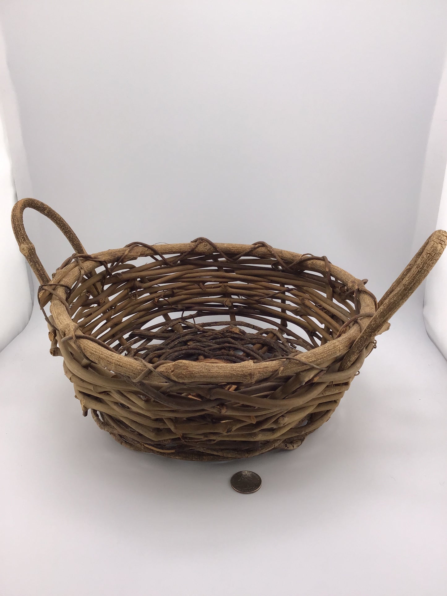Primitive woven grape vine basket