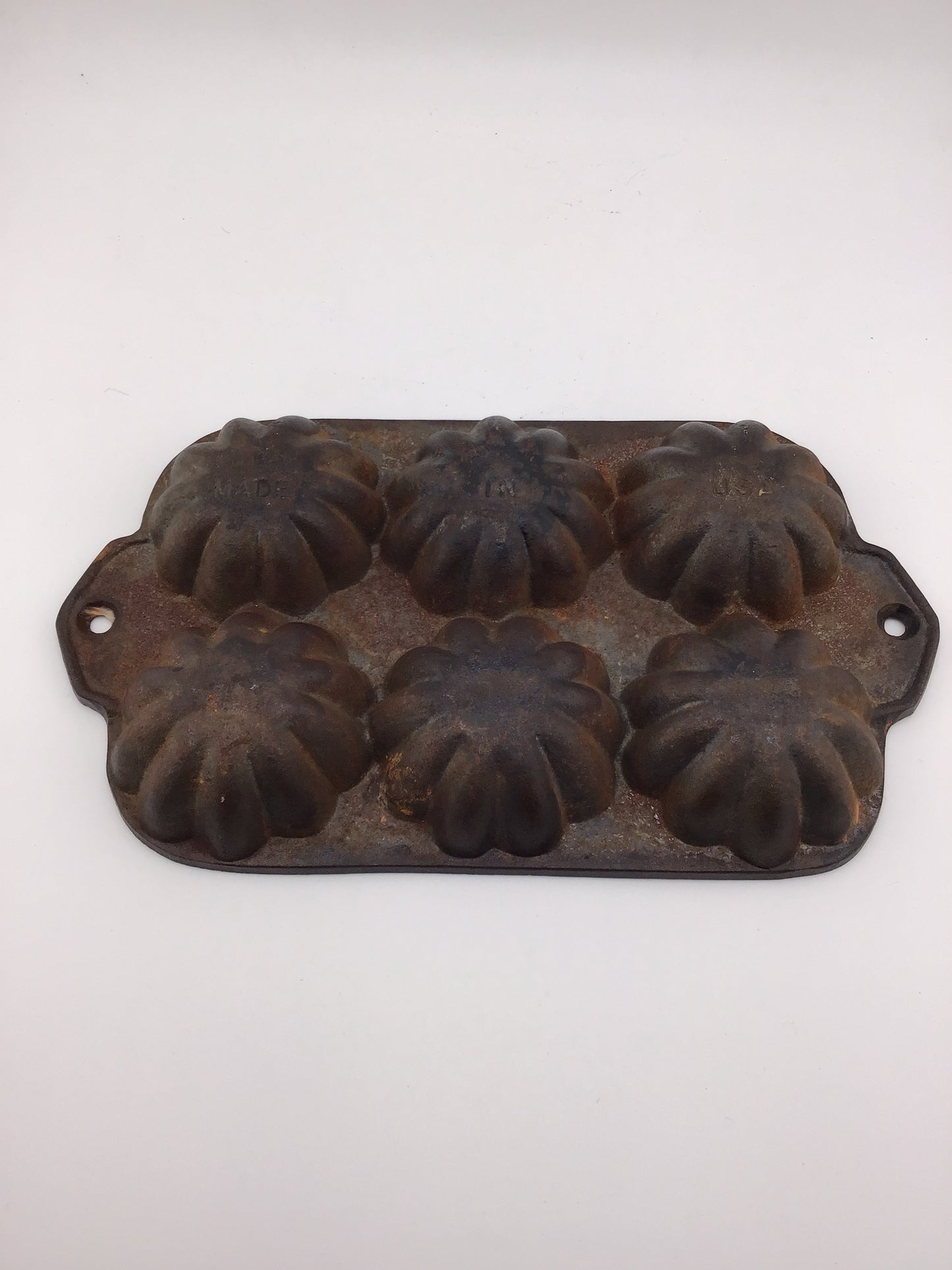 Vintage cast iron Turks muffin pan