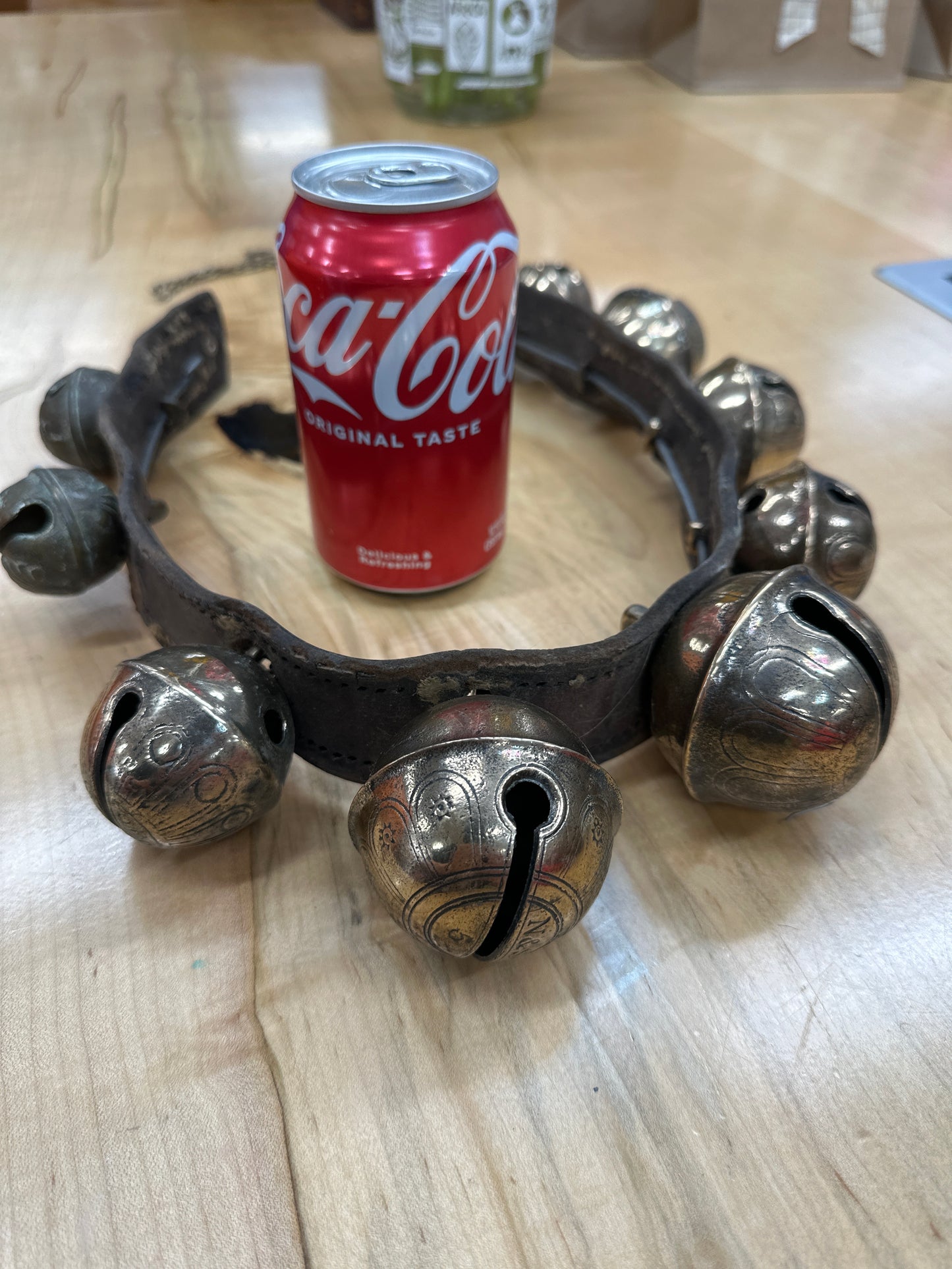 Antique sleigh bells on leather strap