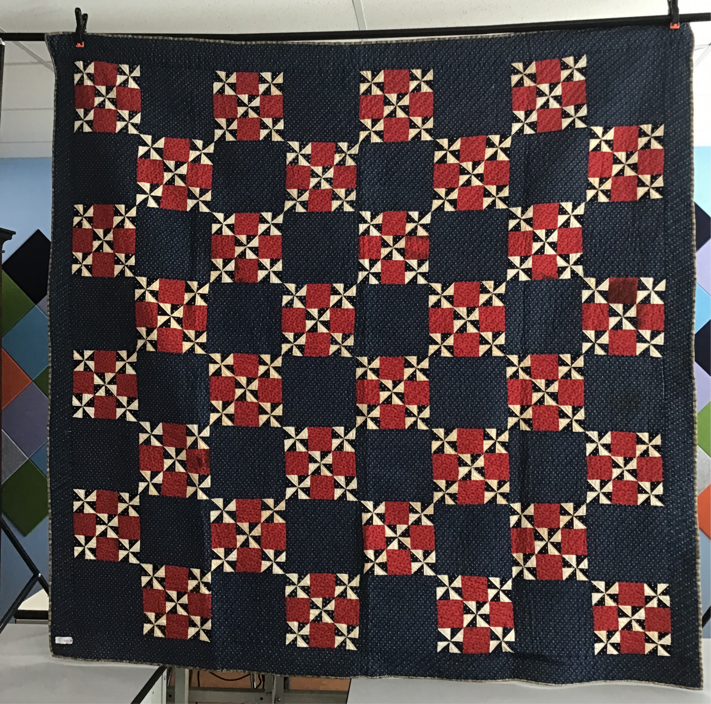 Blue pinwheel with red 9 patch