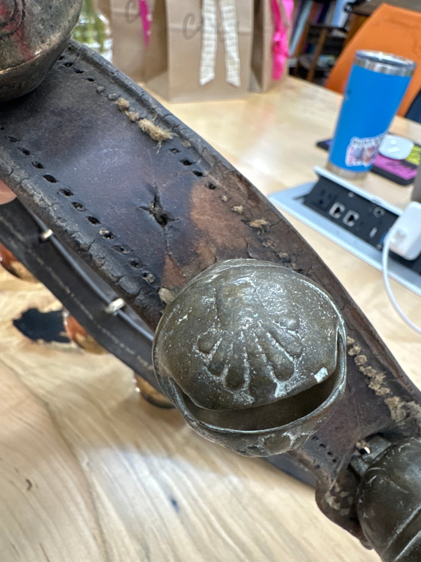 Antique sleigh bells on leather strap