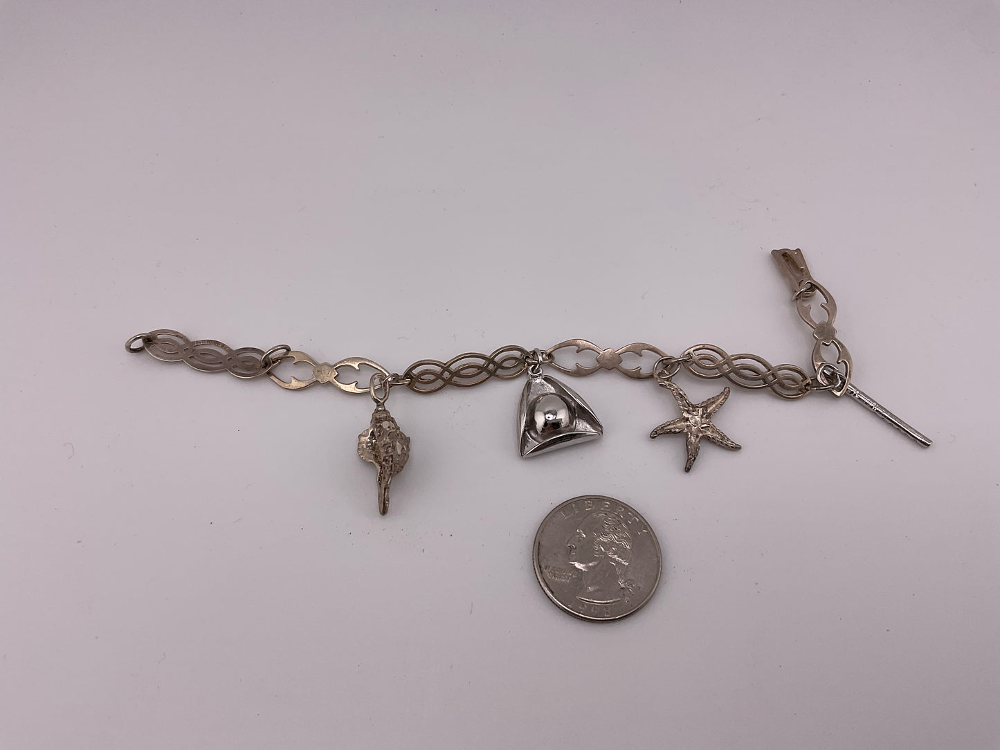 Sterling silver hand forged charm bracelet