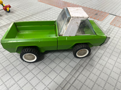 vintage lime green and white Buddy L pressed steel toy truck from the 1960s/1970s era