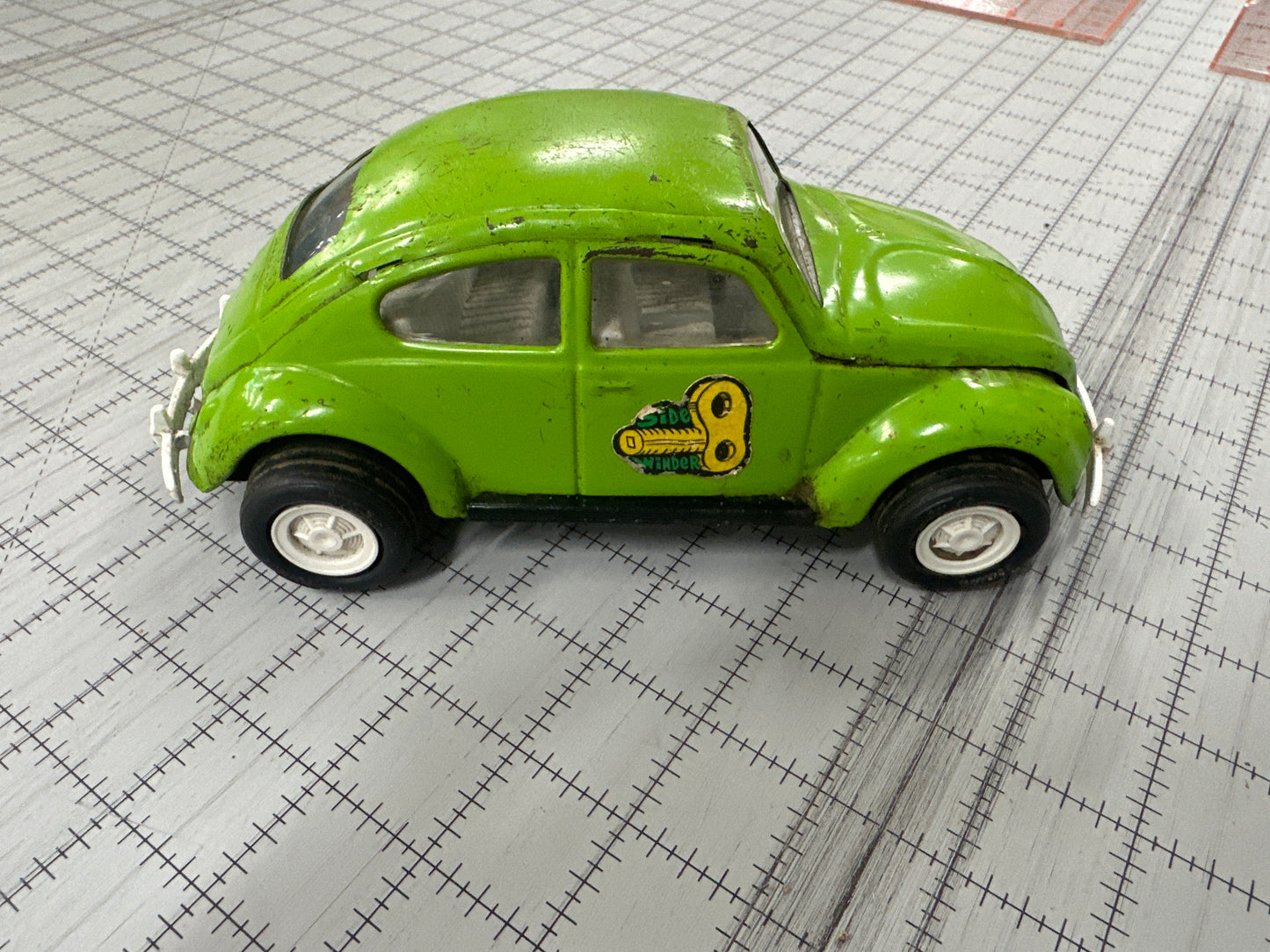 vintage 1970s green Tonka Volkswagen "Side Winder" Beetle pressed-metal toy car