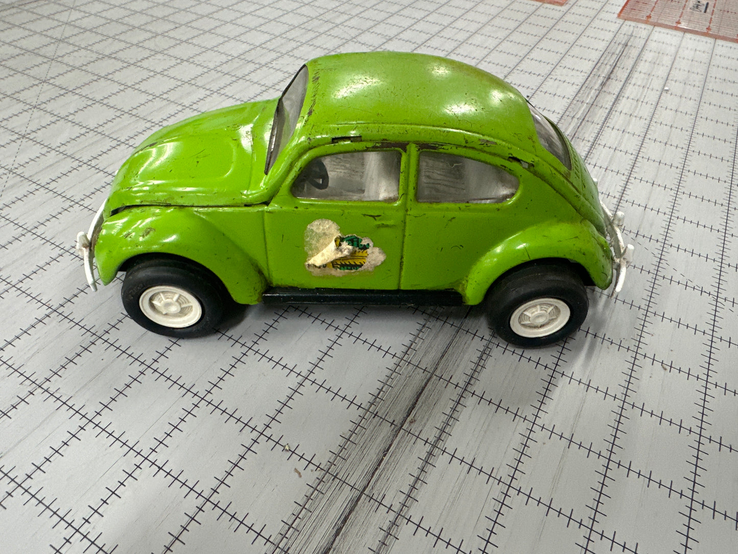 vintage 1970s green Tonka Volkswagen "Side Winder" Beetle pressed-metal toy car