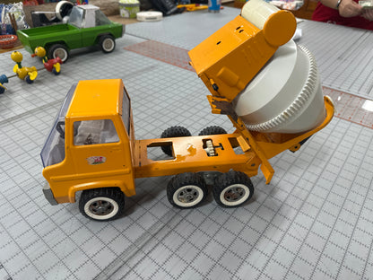 vintage pressed-steel Tonka cab-over concrete mixer truck from the 1960s or 1970