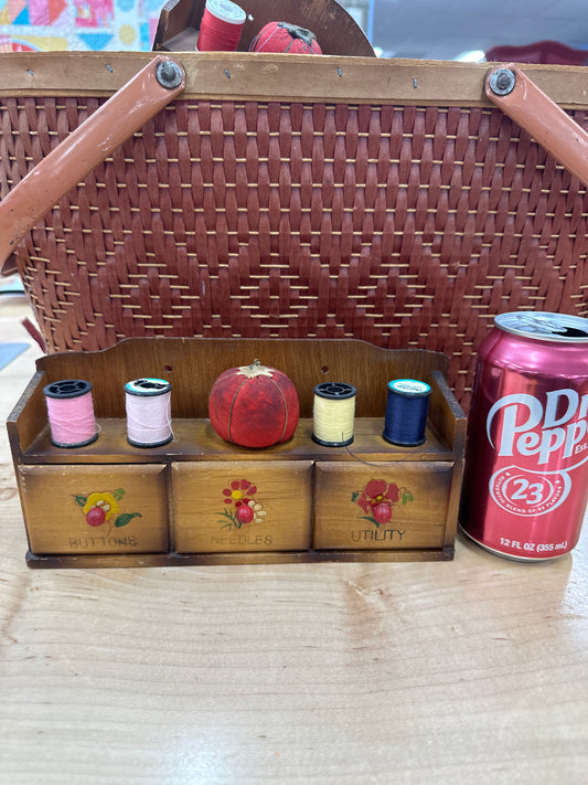 Vintage sewing notions display