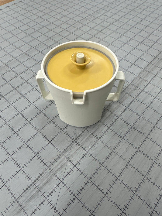 Vintage 1970s Tupperware cream dispenser in a harvest gold color