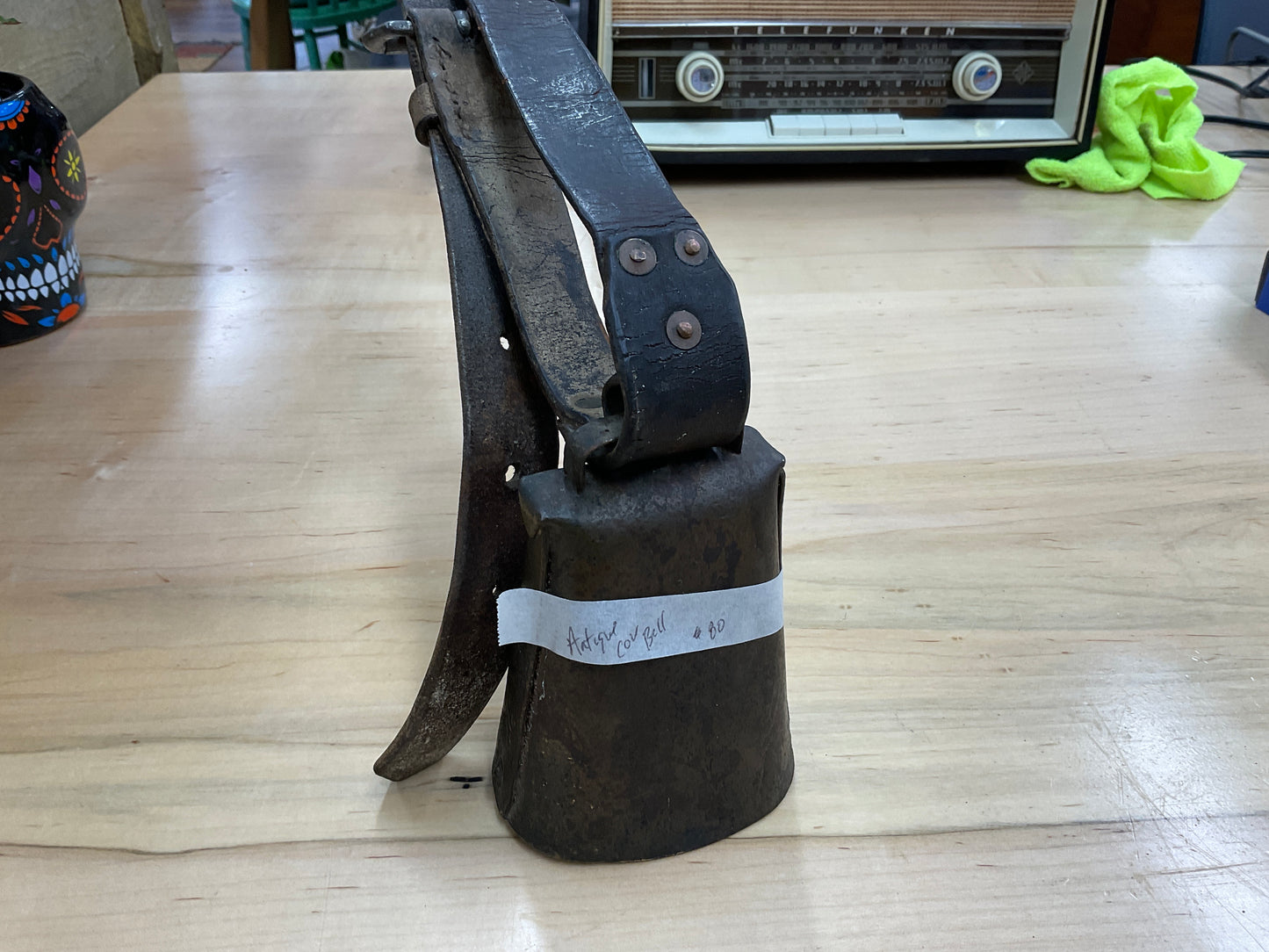 Antique cow bell with strap