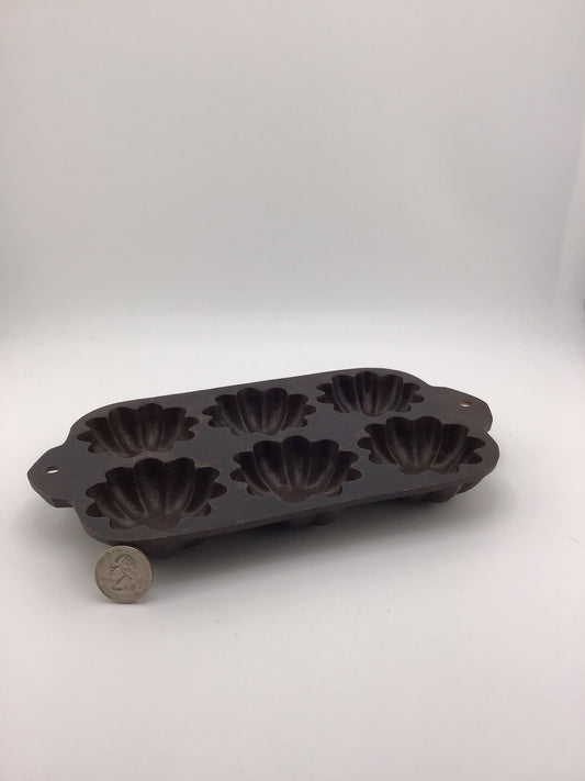 Vintage cast iron Turks muffin pan