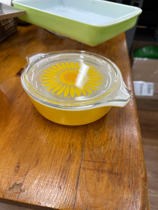 Vintage Yellow Pyrex Daisy casserole dish with a clear lid