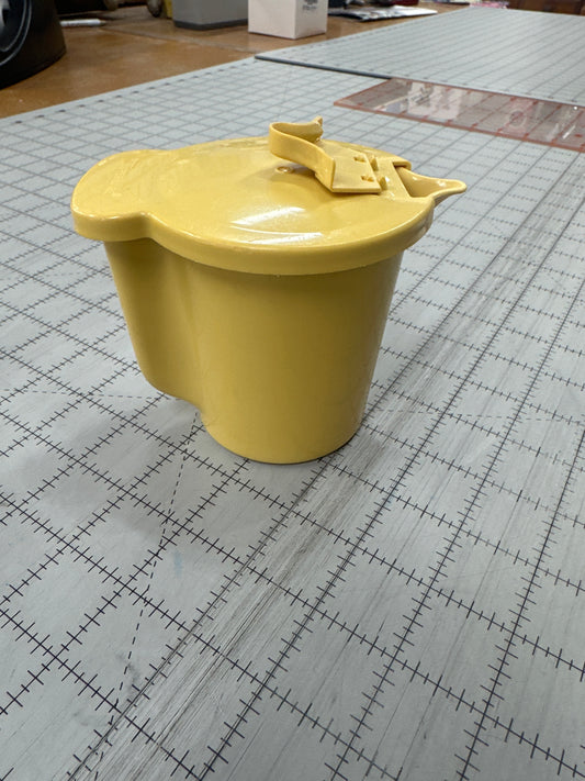 Vintage 1970s Tupperware cream dispenser in a harvest gold color