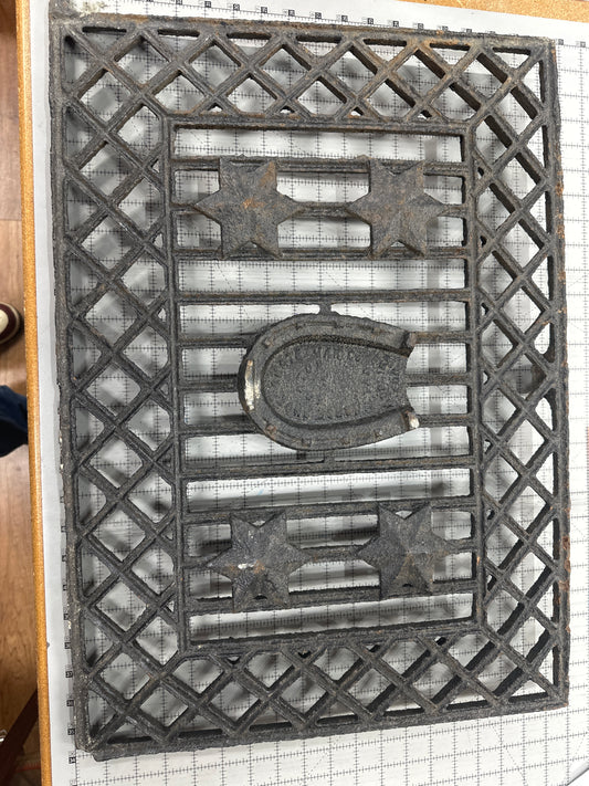 Vintage horseshoe and star metal grate