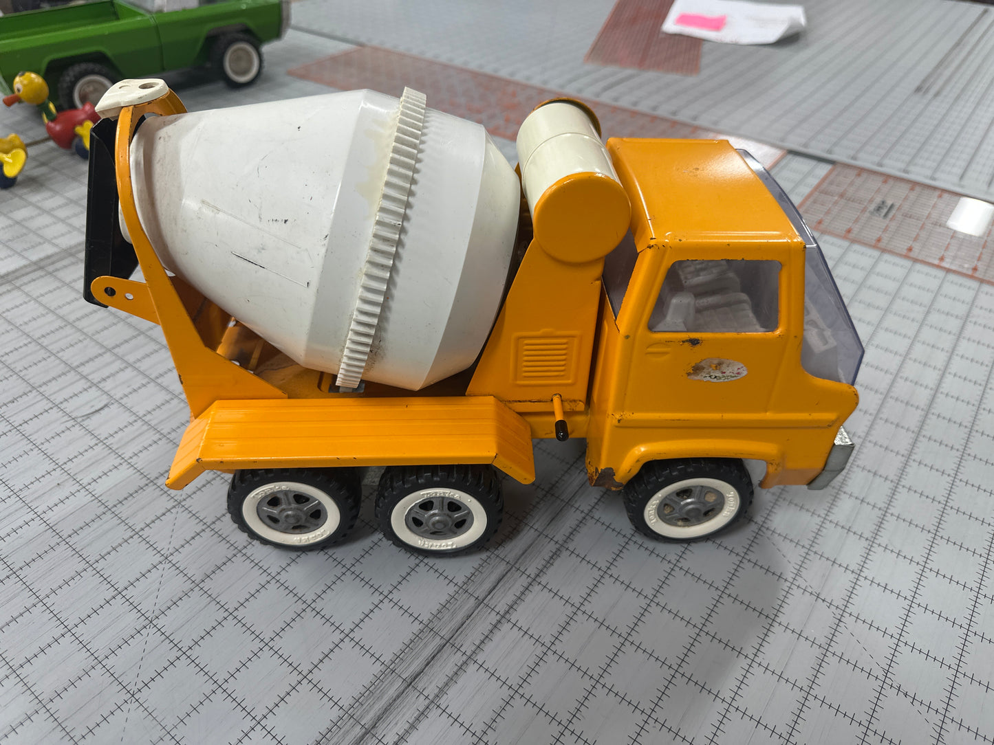 vintage pressed-steel Tonka cab-over concrete mixer truck from the 1960s or 1970