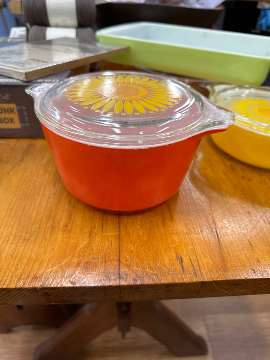 Vintage Orange Pyrex Daisy casserole dish with a clear lid
